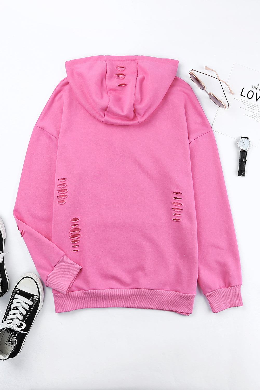 Distressed drawstring long sleeve hoodie with pockets.