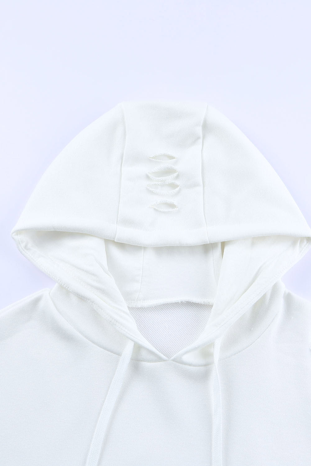 Distressed drawstring long sleeve hoodie with pockets.