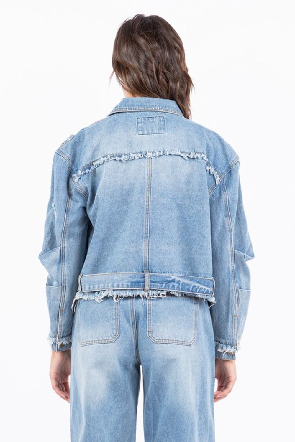 Plus size distressed frayed edge zip up denim jacket with pockets.
