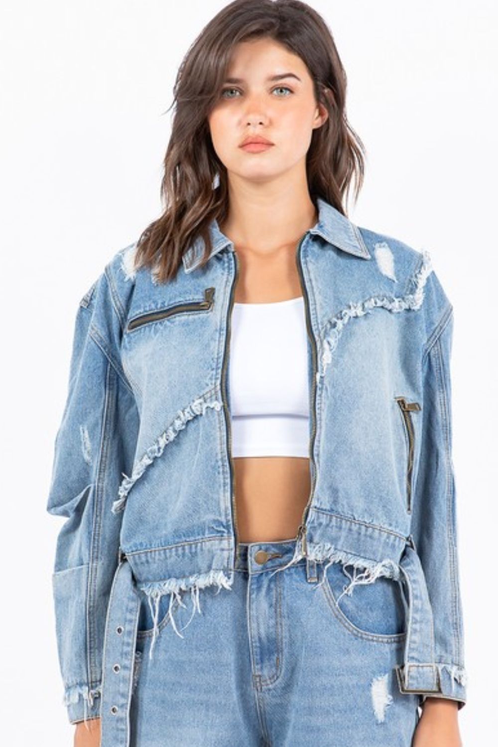 Plus size distressed frayed edge zip up denim jacket with pockets.