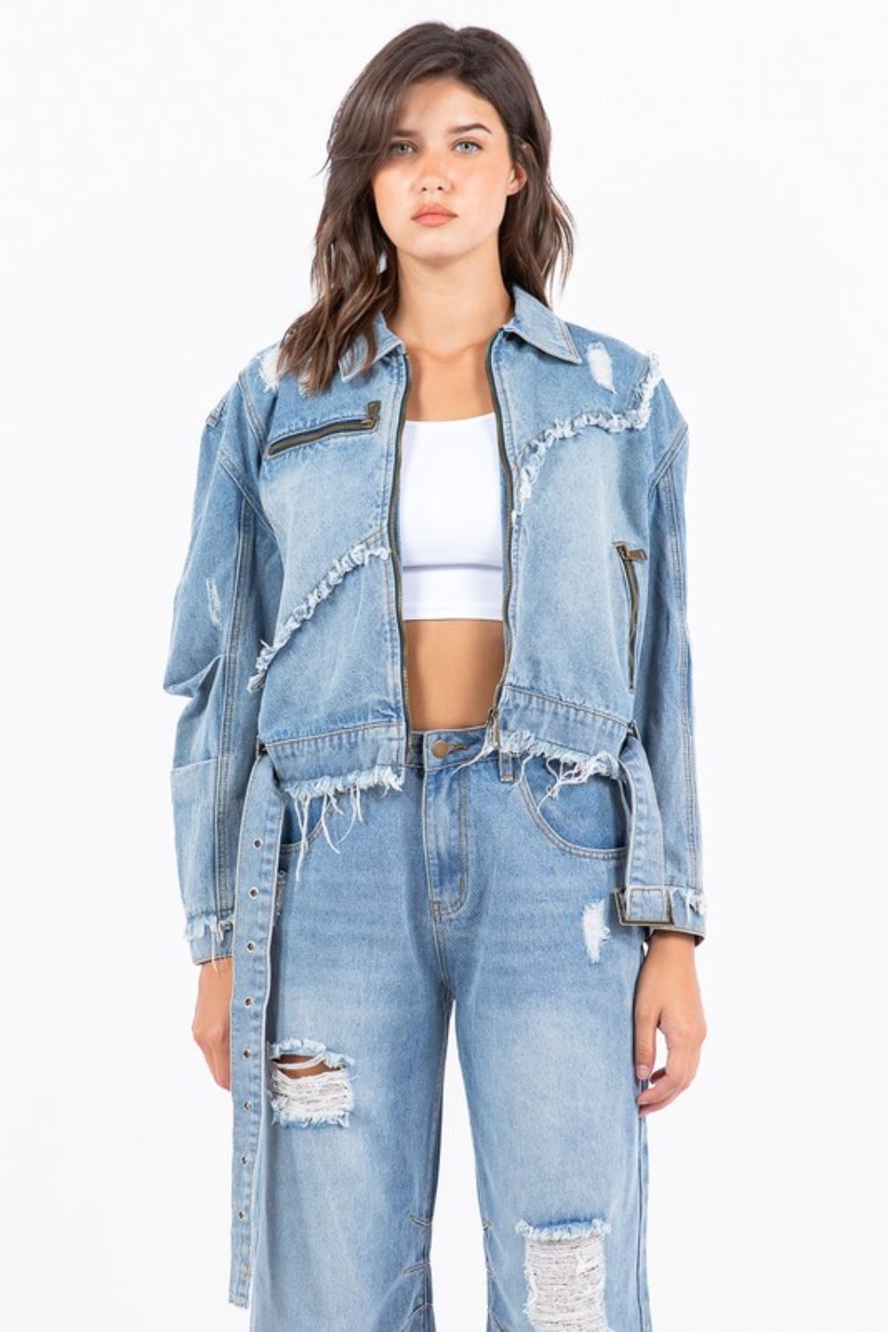 Plus size distressed frayed edge zip up denim jacket with pockets.
