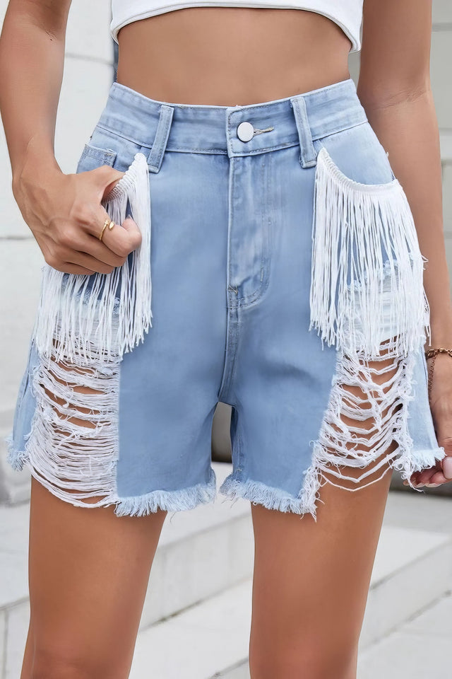 Women's distressed fringe denim shorts with raw hem and pockets.