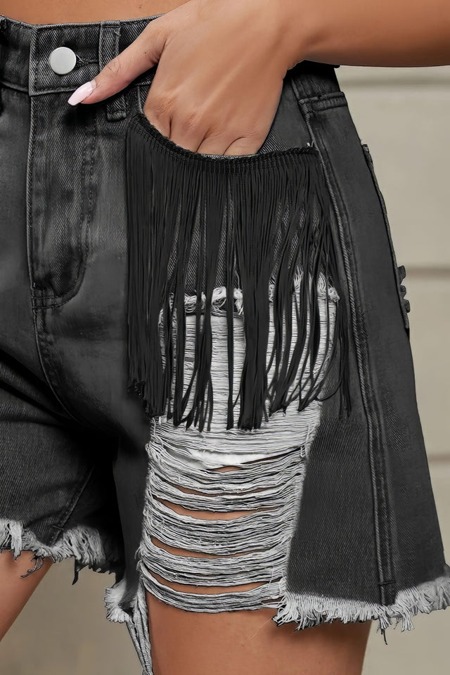 Women's distressed fringe denim shorts with raw hem and pockets.