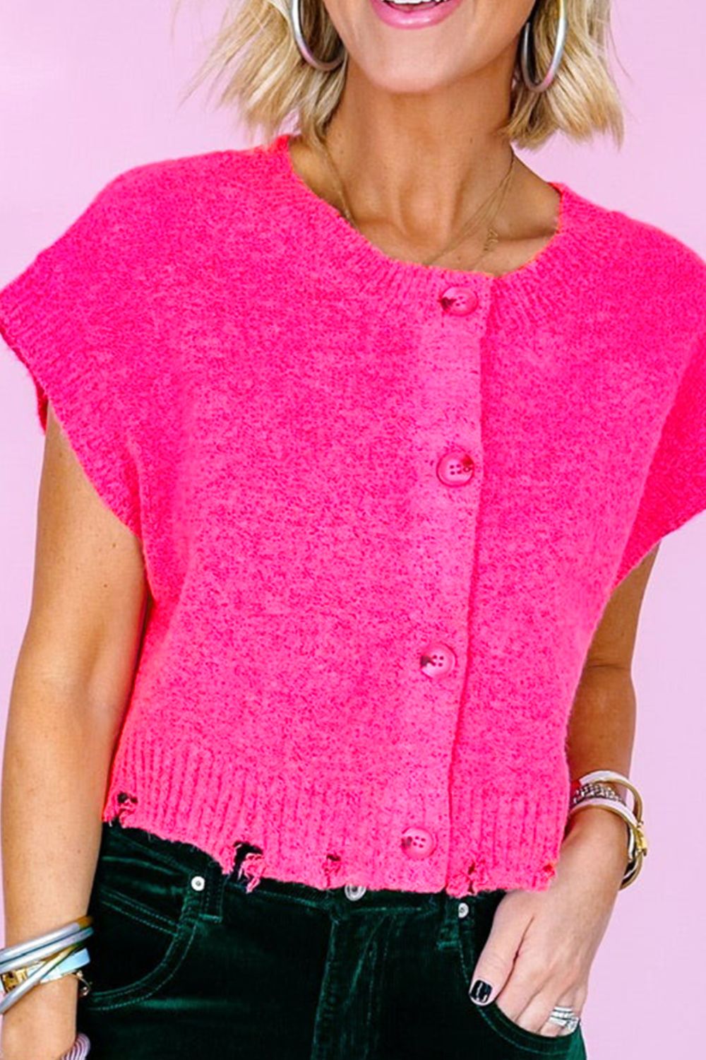 Distressed hem cap sleeve button front sweater.
