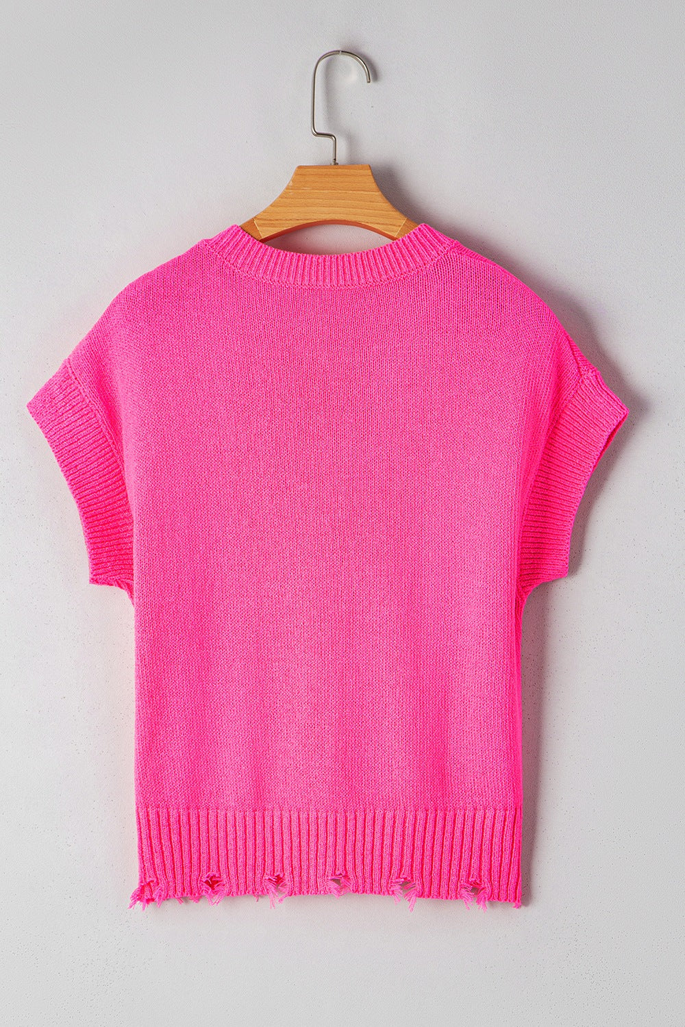 Distressed hem cap sleeve button front sweater.