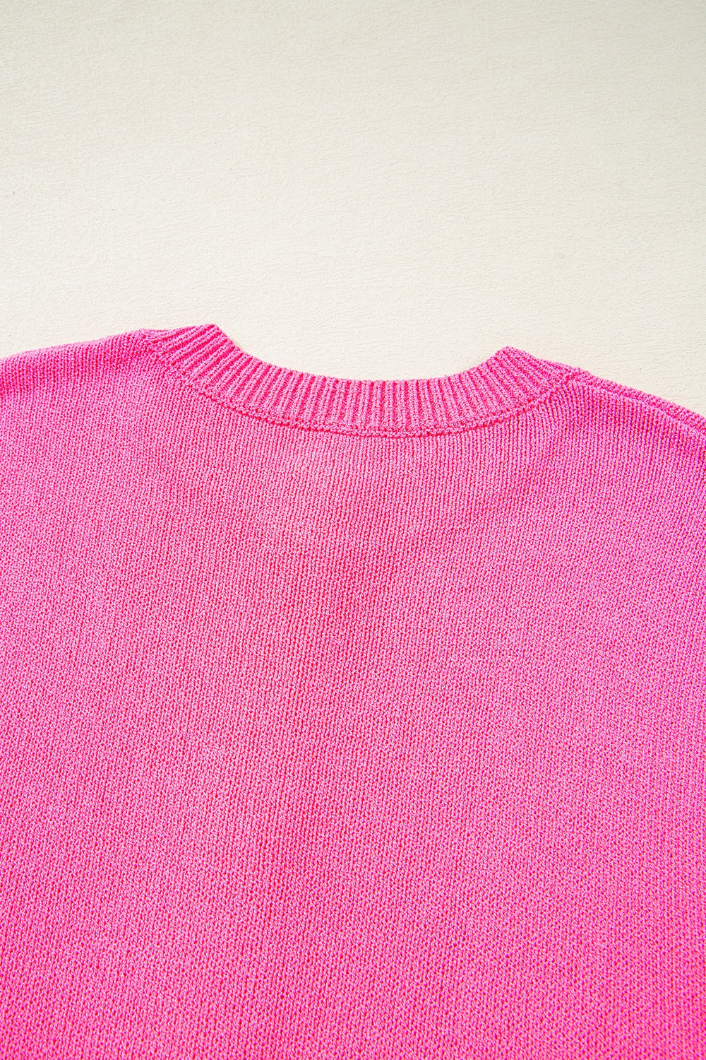 Distressed hem cap sleeve button front sweater.