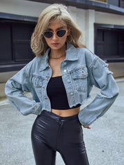 Distressed raw hem cropped denim jacket with buttoned pockets.