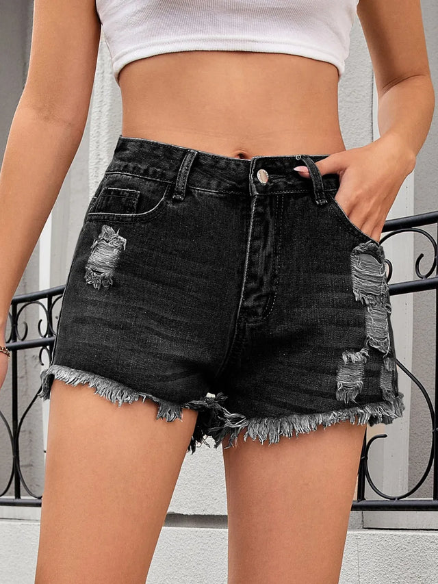 Distressed raw hem denim shorts.