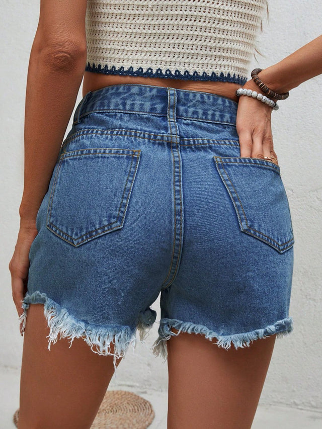 Distressed raw hem denim shorts with buttons and pockets.