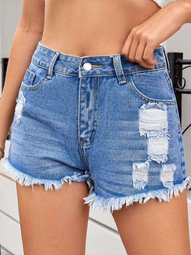 Distressed raw hem denim shorts.