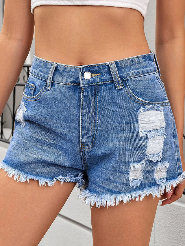 Distressed raw hem denim shorts.