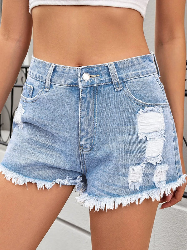 Distressed raw hem denim shorts.