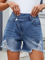 Distressed raw hem asymmetrical waist denim shorts.