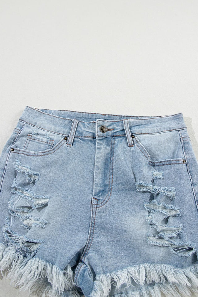 Distressed raw hem high waist denim shorts.