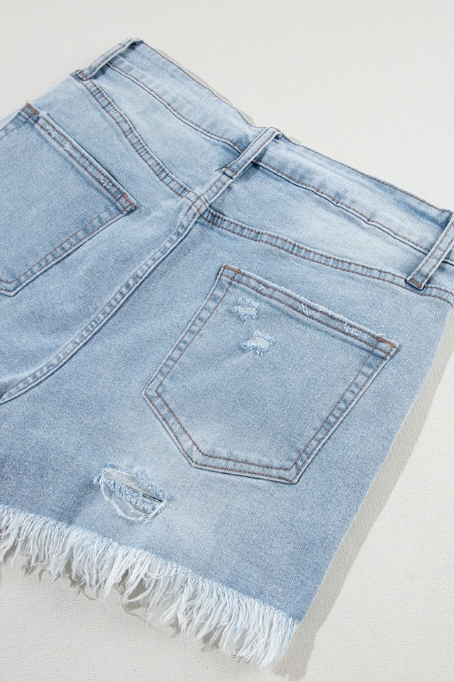 Distressed raw hem high waist denim shorts.