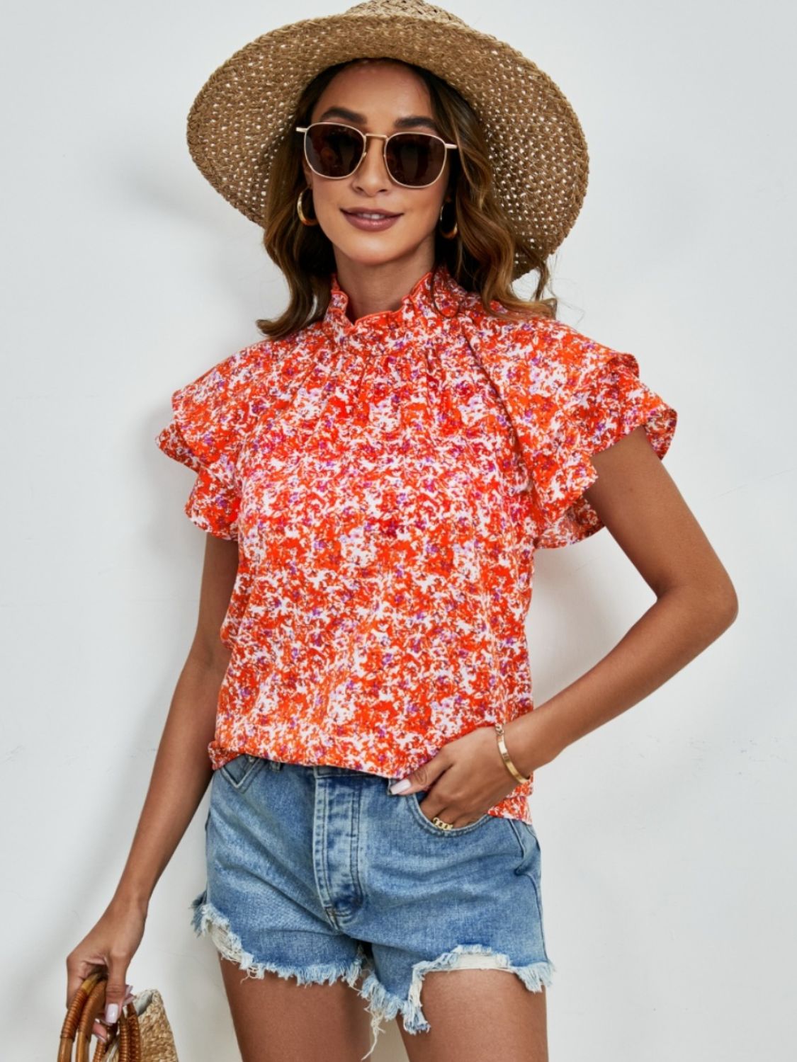Ditsy floral mock neck flounce sleeve blouse with frill and ruched details.