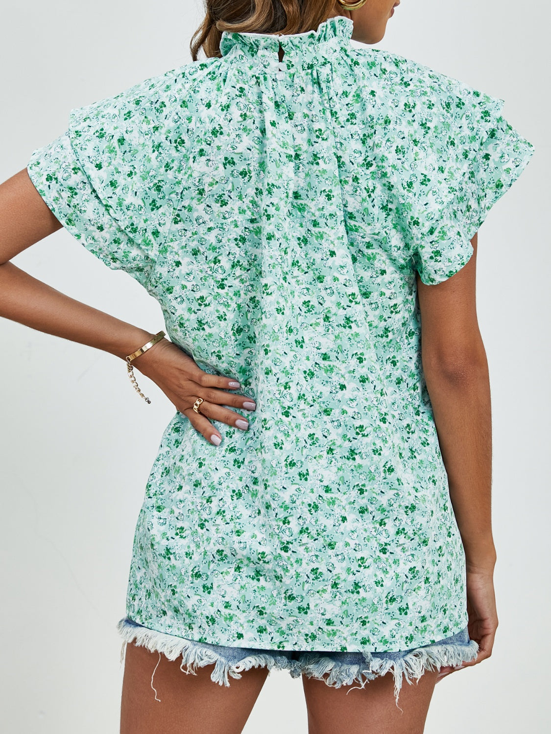 Ditsy floral mock neck flounce sleeve blouse with frill and ruched details.
