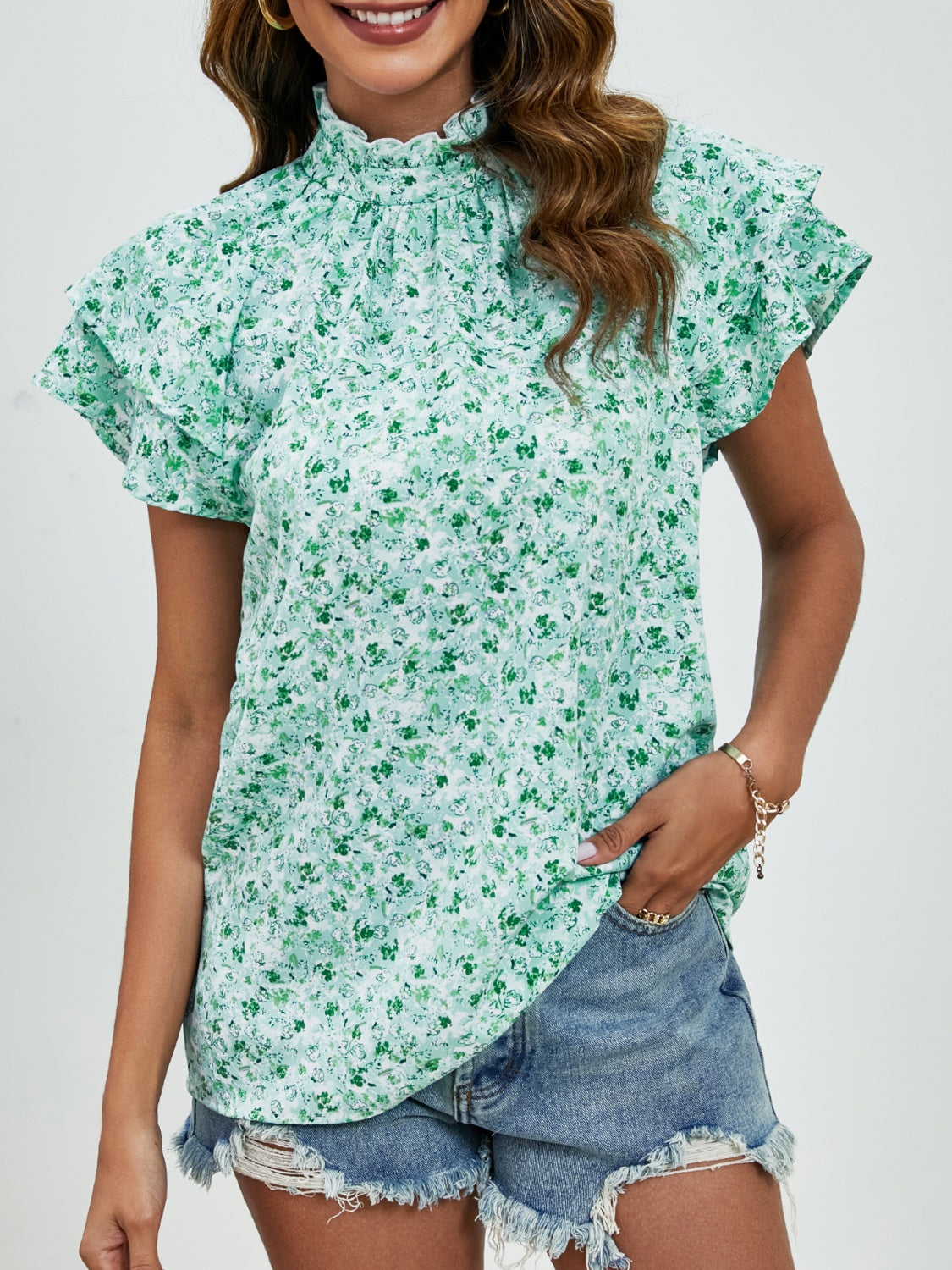 Ditsy floral mock neck flounce sleeve blouse with frill and ruched details.