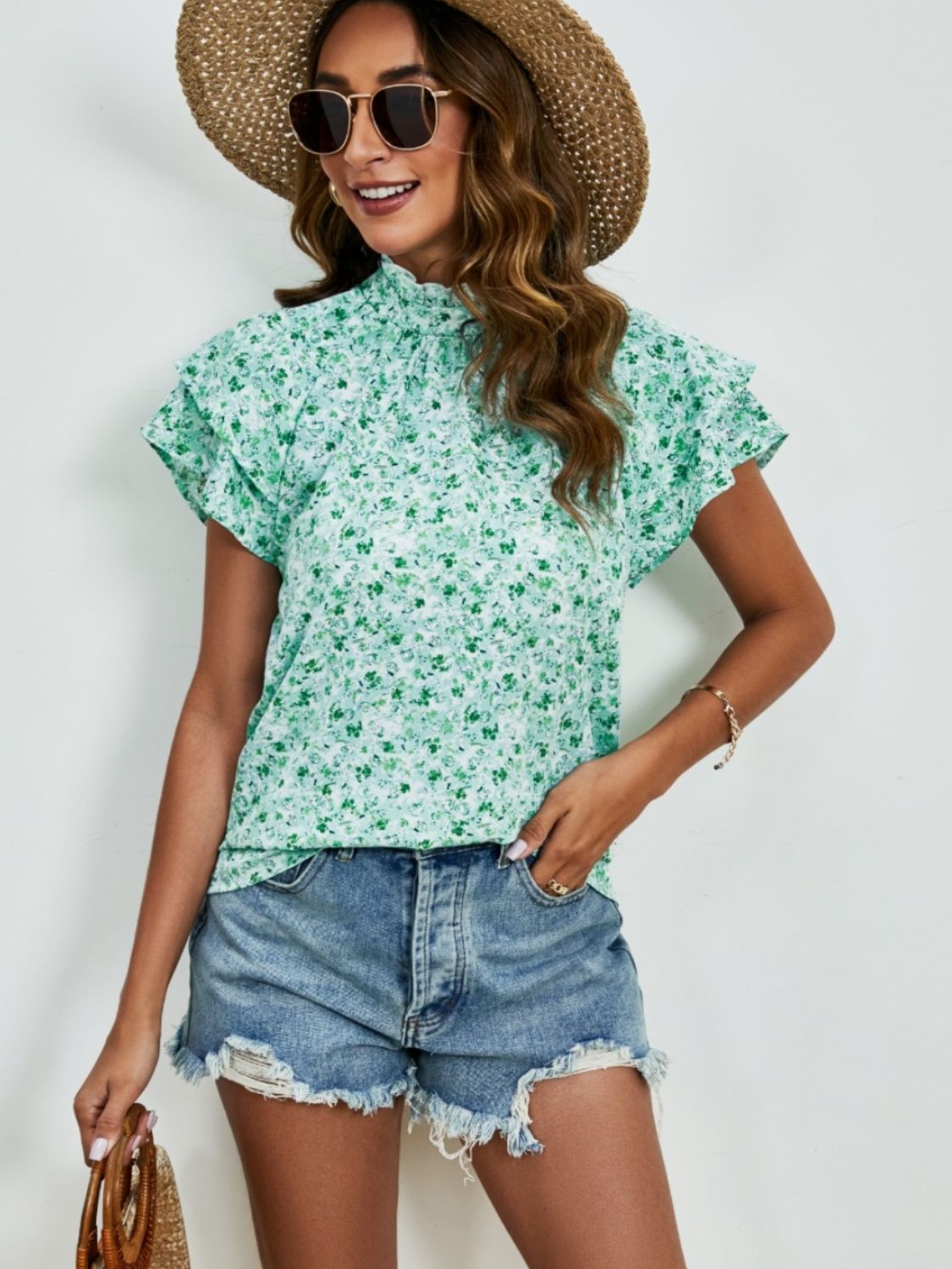 Ditsy floral mock neck flounce sleeve blouse with frill and ruched details.