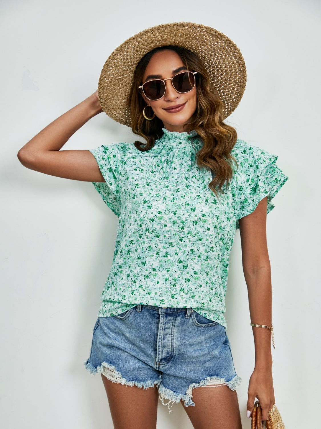 Ditsy floral mock neck flounce sleeve blouse with frill and ruched details.