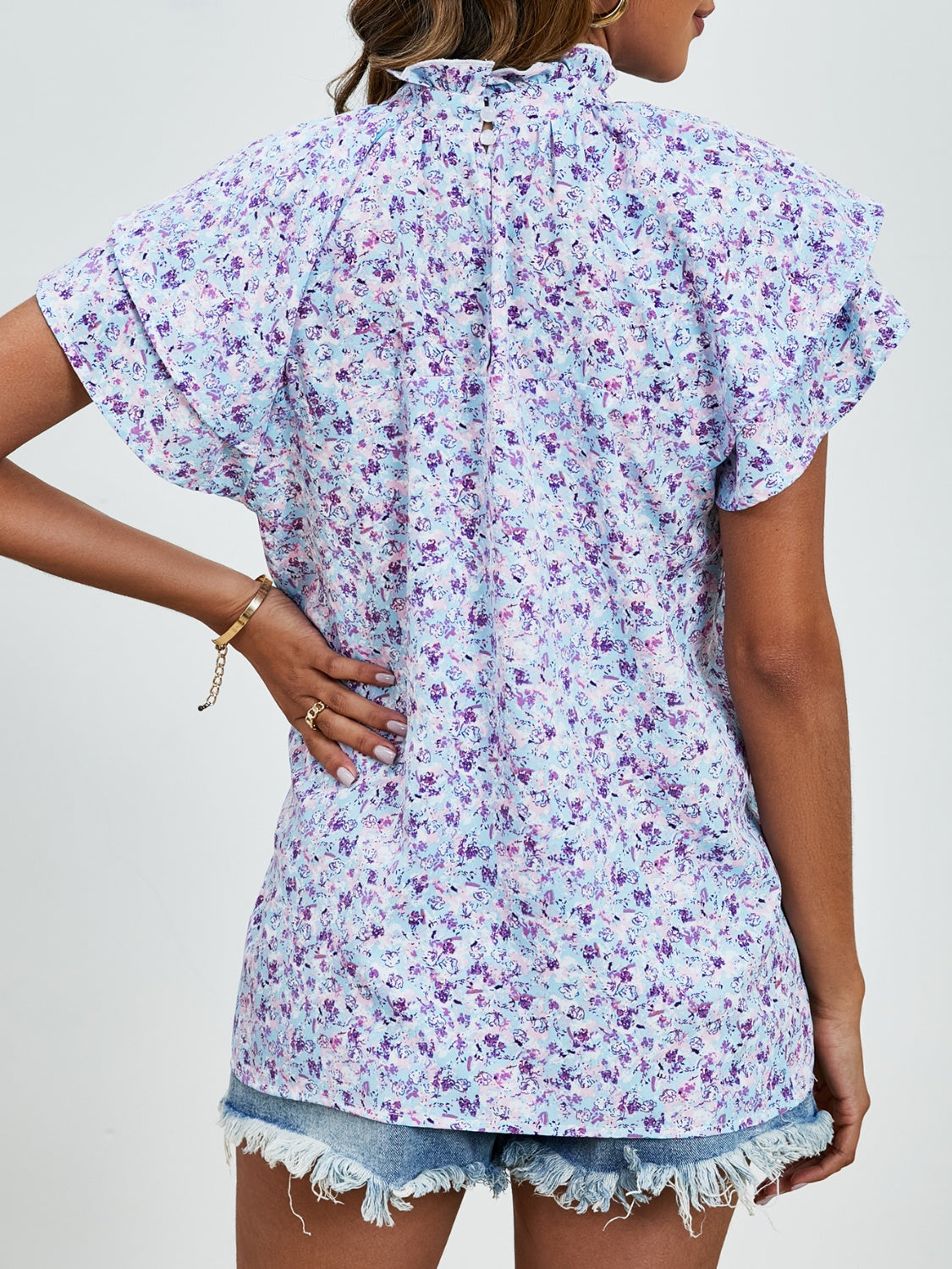 Ditsy floral mock neck flounce sleeve blouse with frill and ruched details.