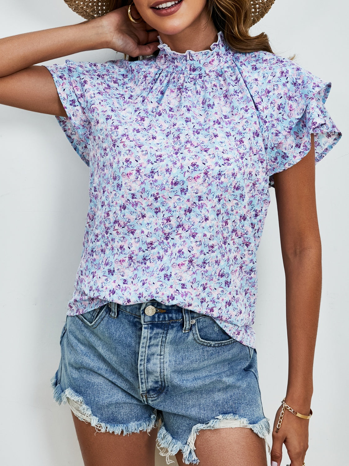 Ditsy floral mock neck flounce sleeve blouse with frill and ruched details.