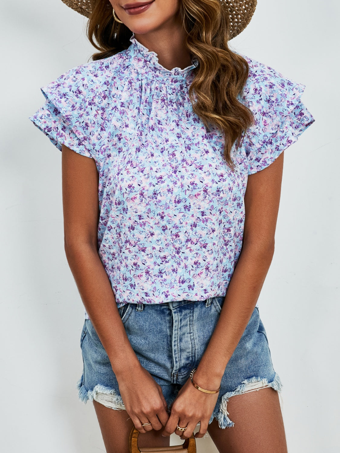 Ditsy floral mock neck flounce sleeve blouse with frill and ruched details.