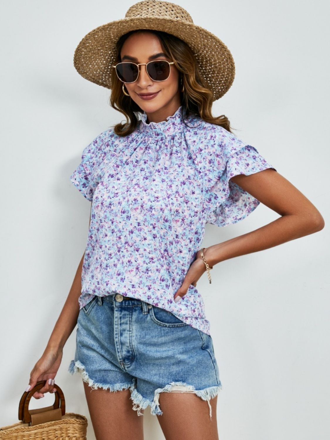 Ditsy floral mock neck flounce sleeve blouse with frill and ruched details.