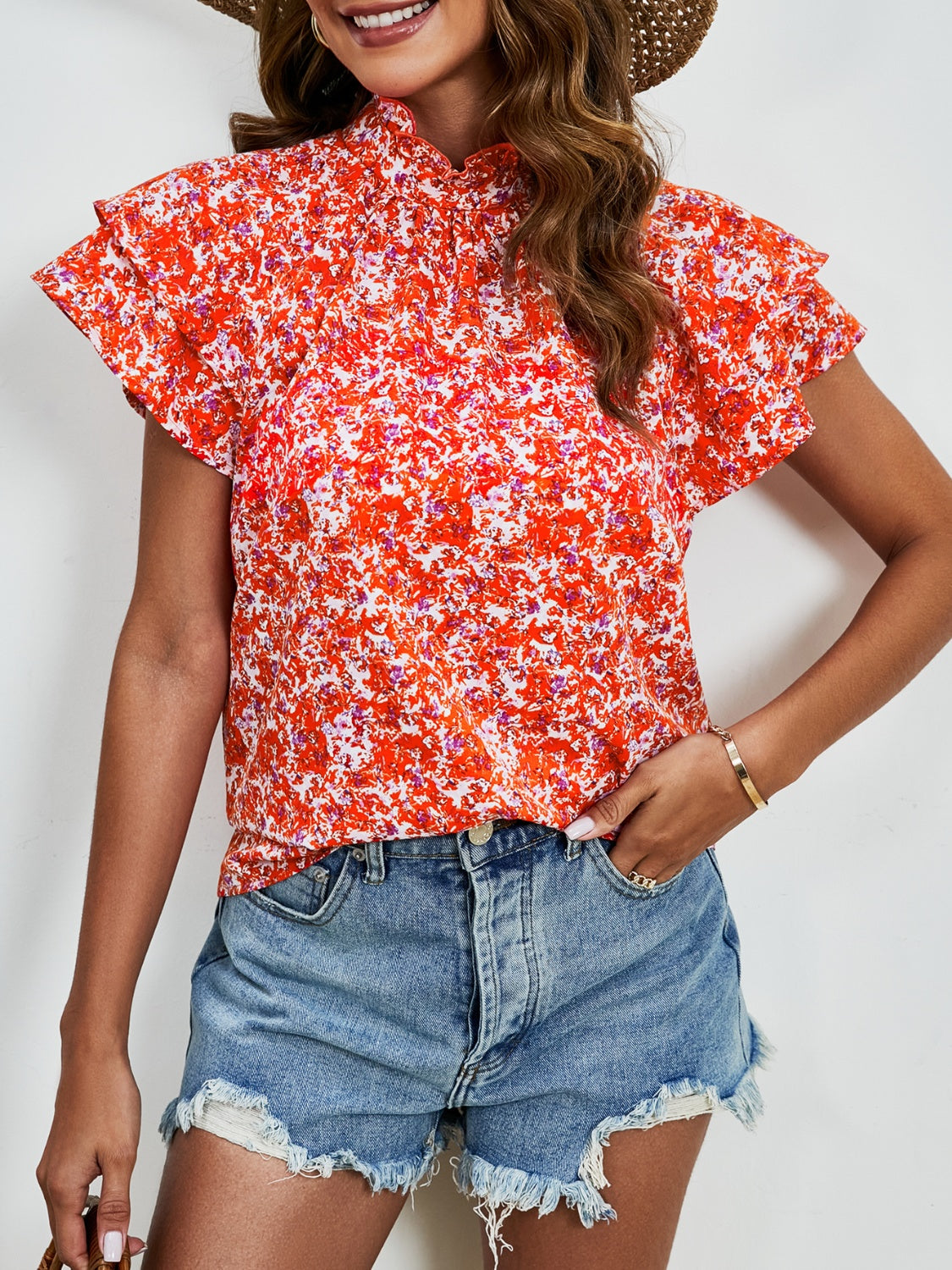 Ditsy floral mock neck flounce sleeve blouse with frill and ruched details.