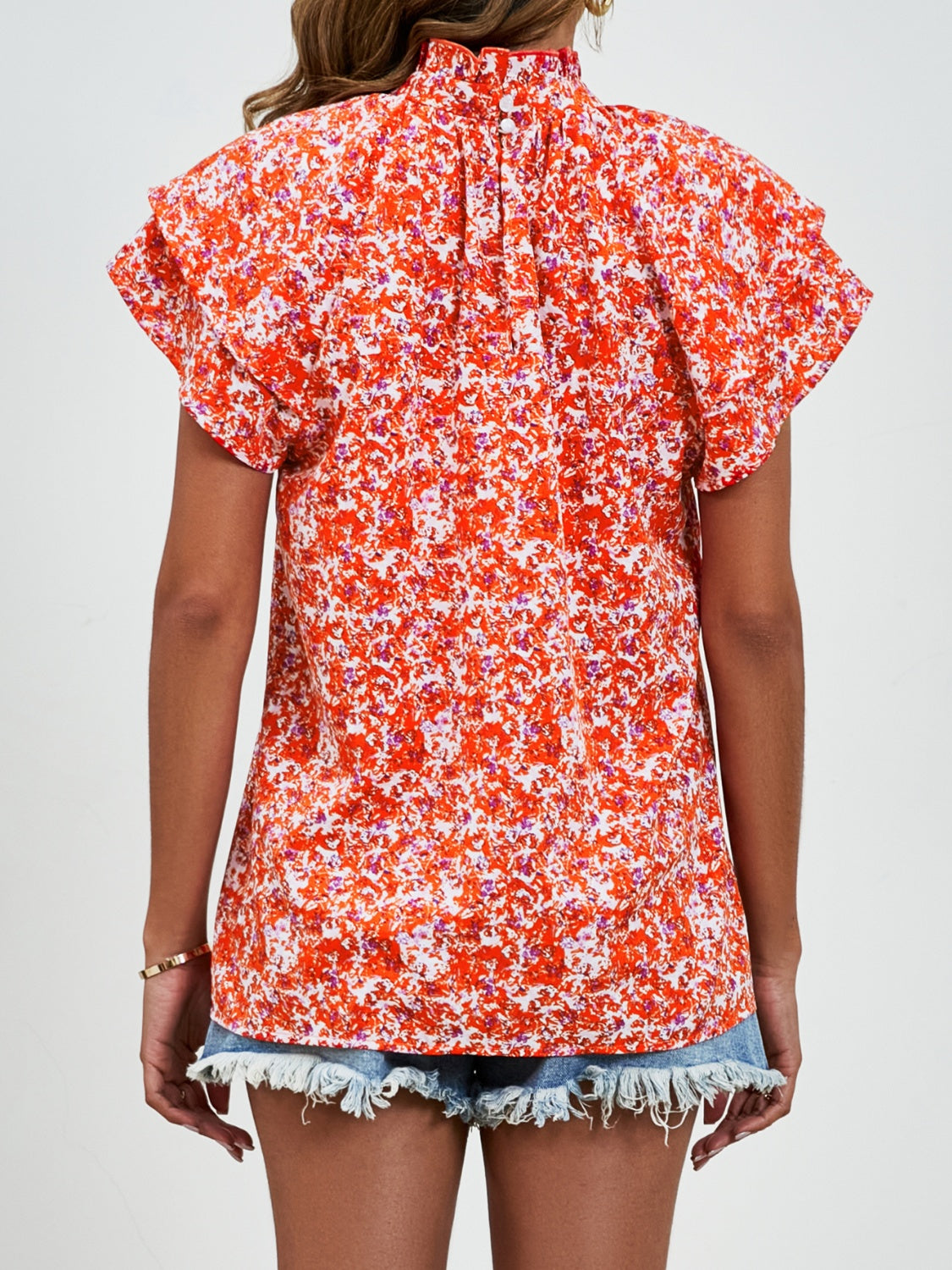 Ditsy floral mock neck flounce sleeve blouse with frill and ruched details.