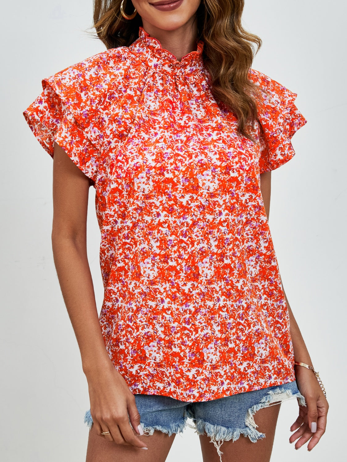 Ditsy floral mock neck flounce sleeve blouse with frill and ruched details.