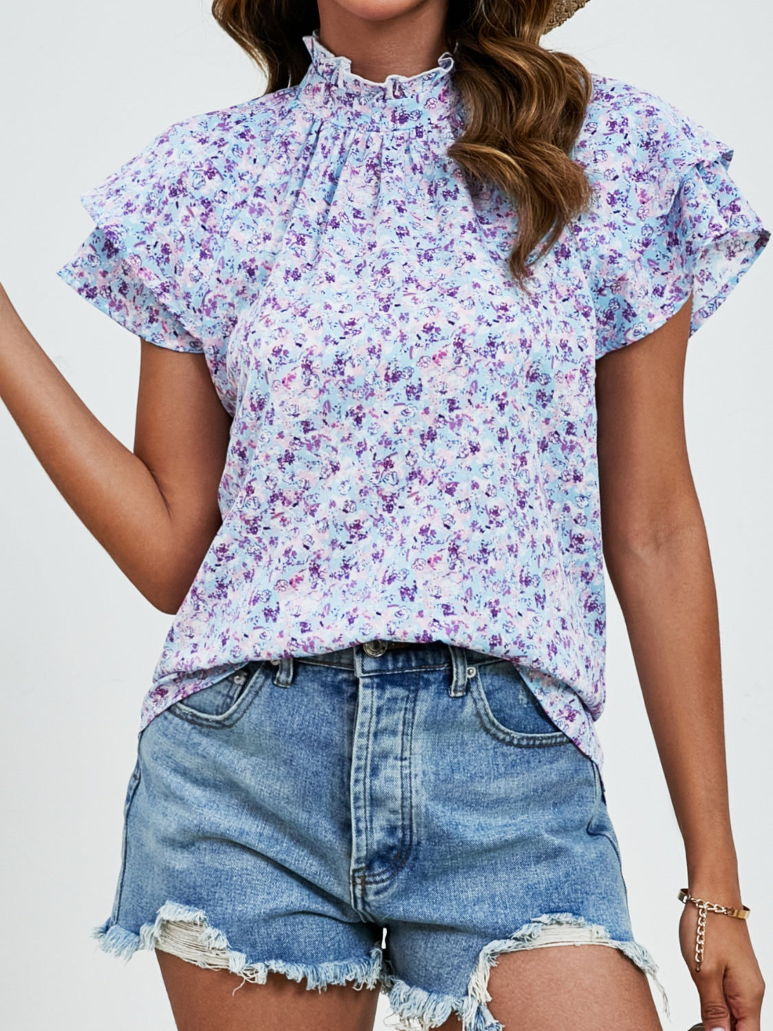 Ditsy floral mock neck flounce sleeve blouse with frill and ruched details.