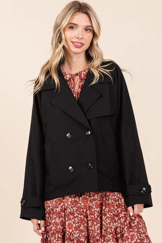 Double-breasted long sleeve trench coat jacket with pockets and buttons.
