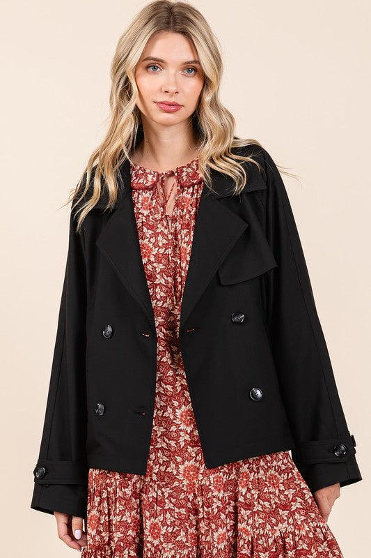Double-breasted long sleeve trench coat jacket with pockets and buttons.