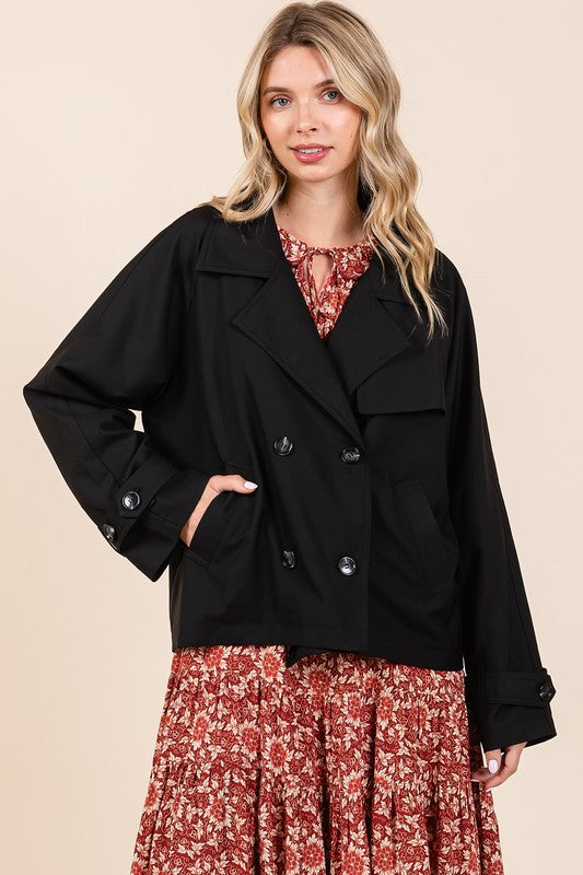 Double-breasted long sleeve trench coat jacket with pockets and buttons.
