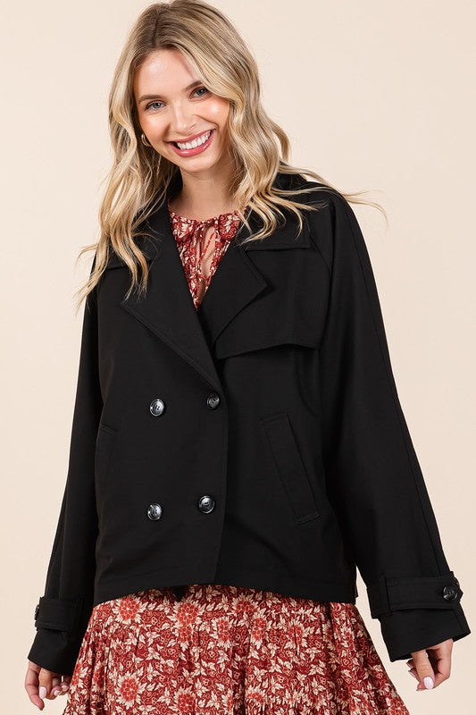 Double-breasted long sleeve trench coat jacket with pockets and buttons.