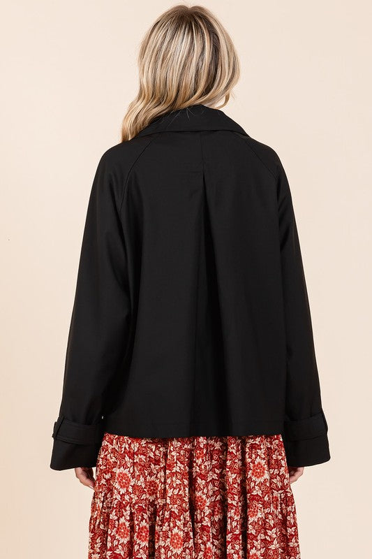Double-breasted long sleeve trench coat jacket with pockets and buttons.