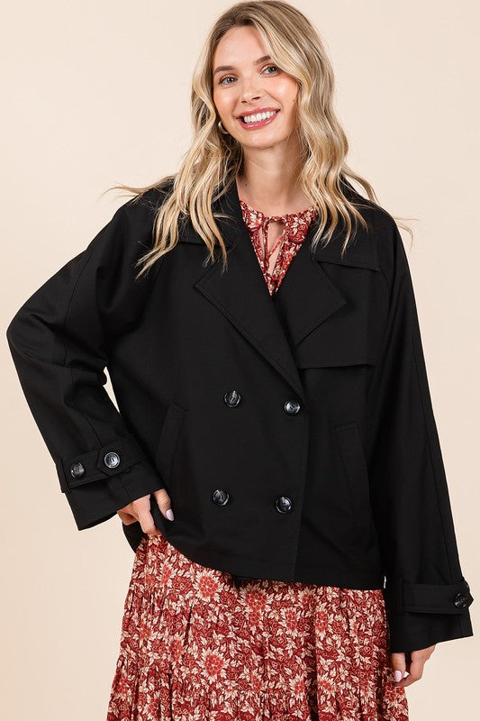 Double-breasted long sleeve trench coat jacket with pockets and buttons.