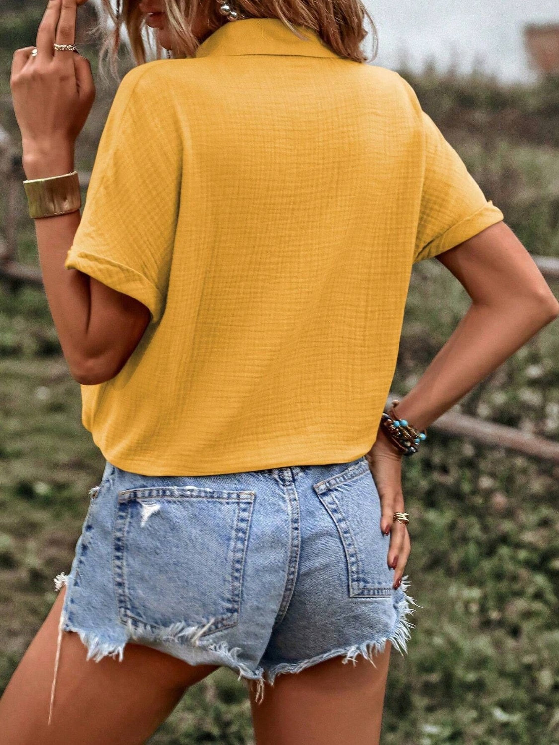 Drawstring button-up short sleeve blouse.