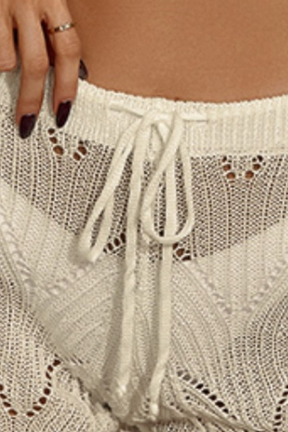 Drawstring cutout swim shorts.