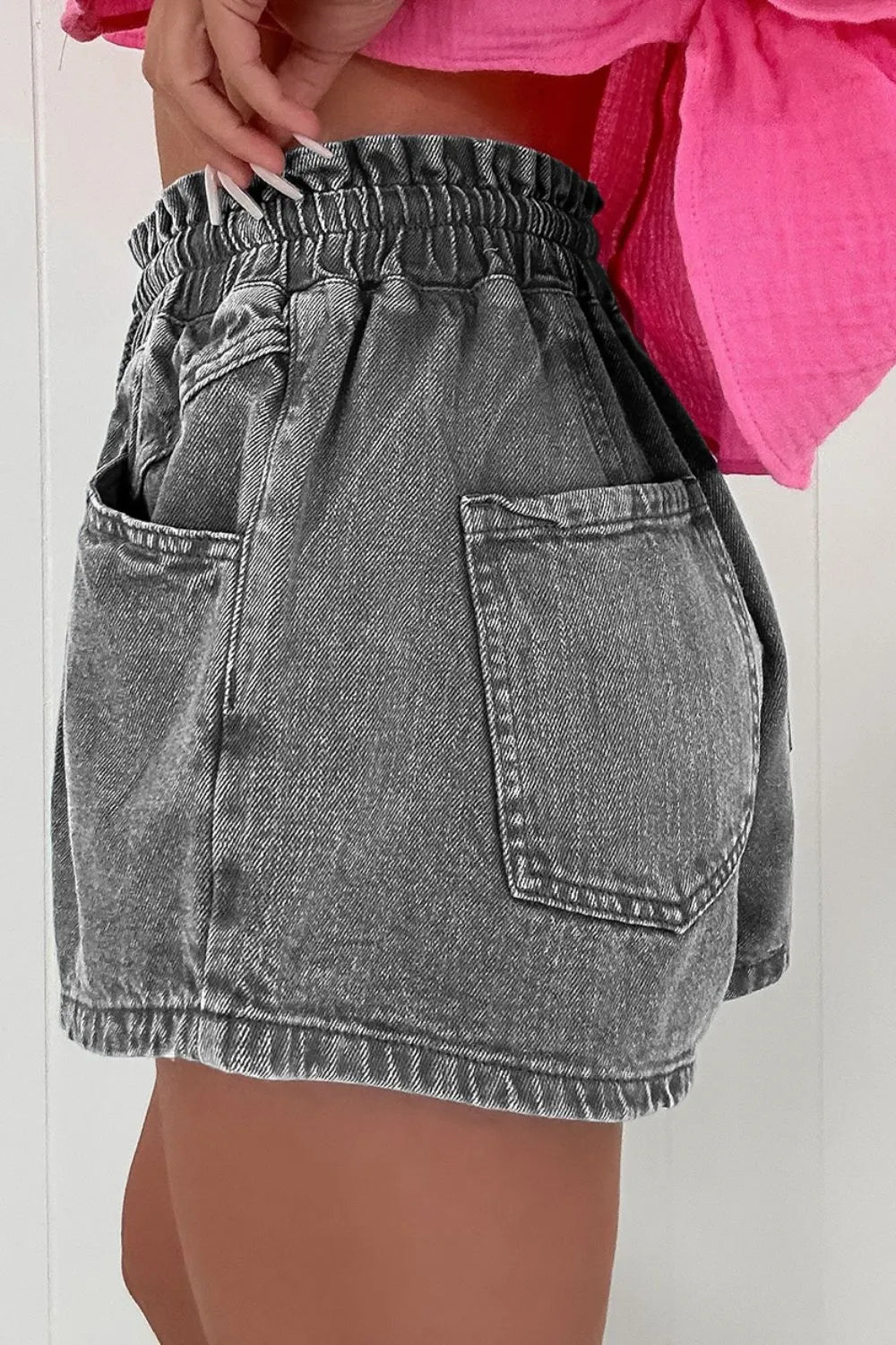 Drawstring denim shorts with pockets.