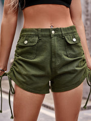 Drawstring denim shorts with pockets and buttons.