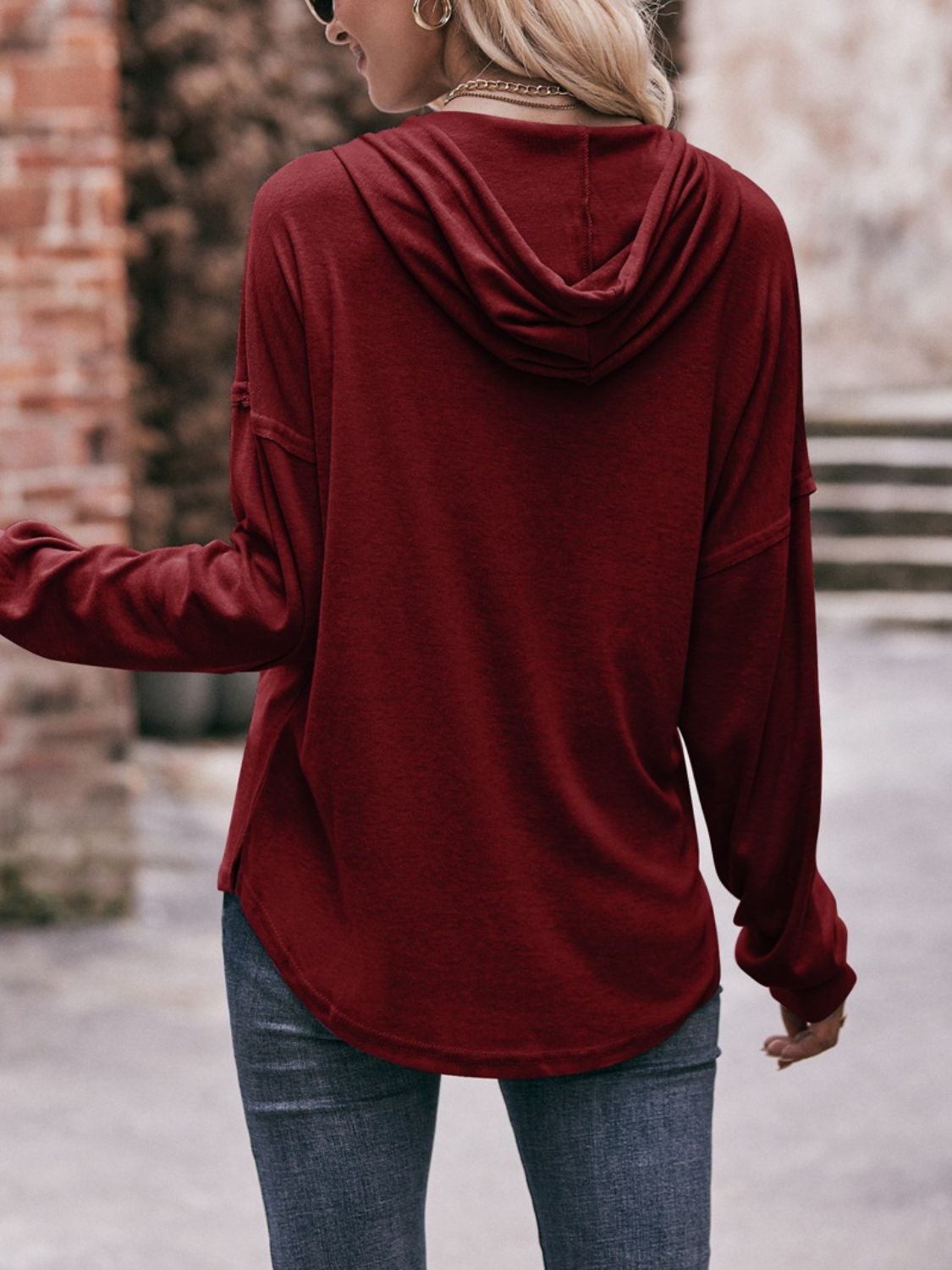 Drawstring drop shoulder long sleeve hoodie with buttons.