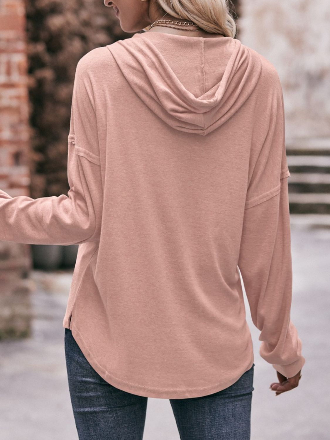 Drawstring drop shoulder long sleeve hoodie with buttons.