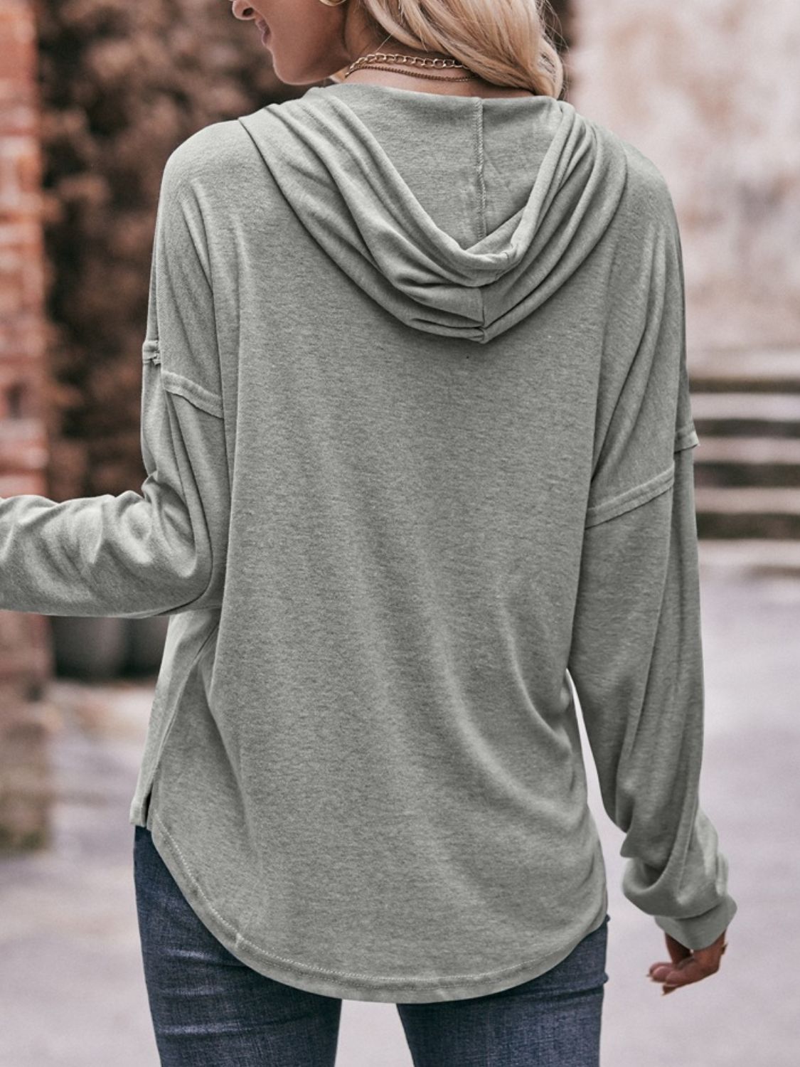 Drawstring drop shoulder long sleeve hoodie with buttons.