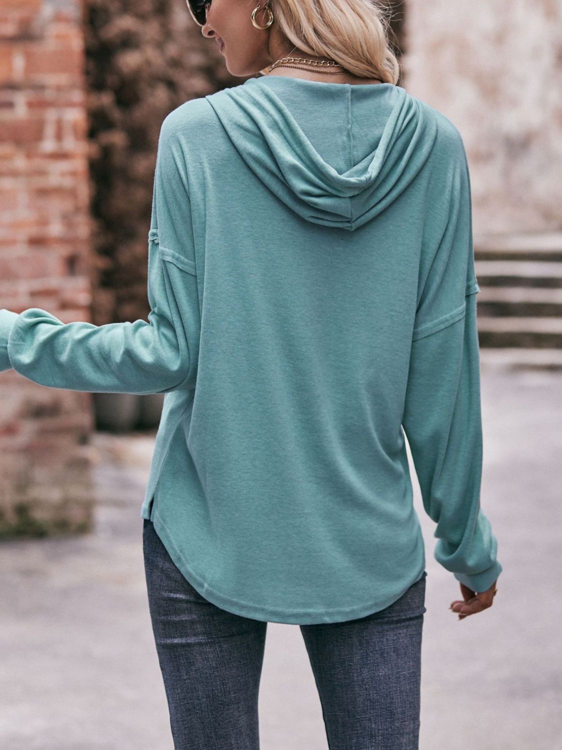 Drawstring drop shoulder long sleeve hoodie with buttons.