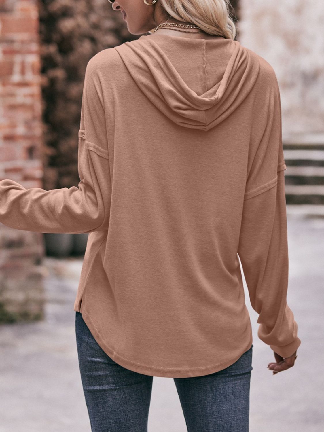 Drawstring drop shoulder long sleeve hoodie with buttons.
