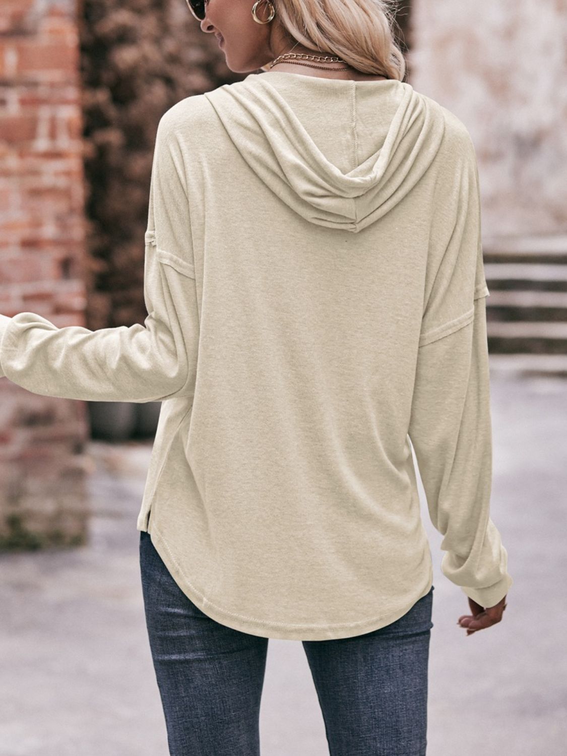 Drawstring drop shoulder long sleeve hoodie with buttons.
