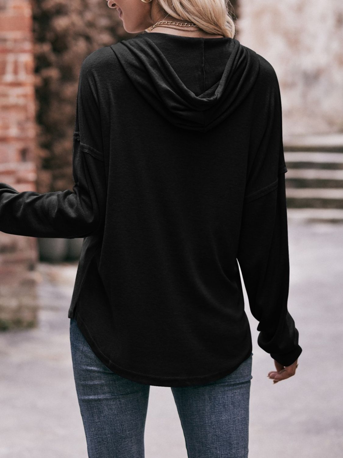 Drawstring drop shoulder long sleeve hoodie with buttons.