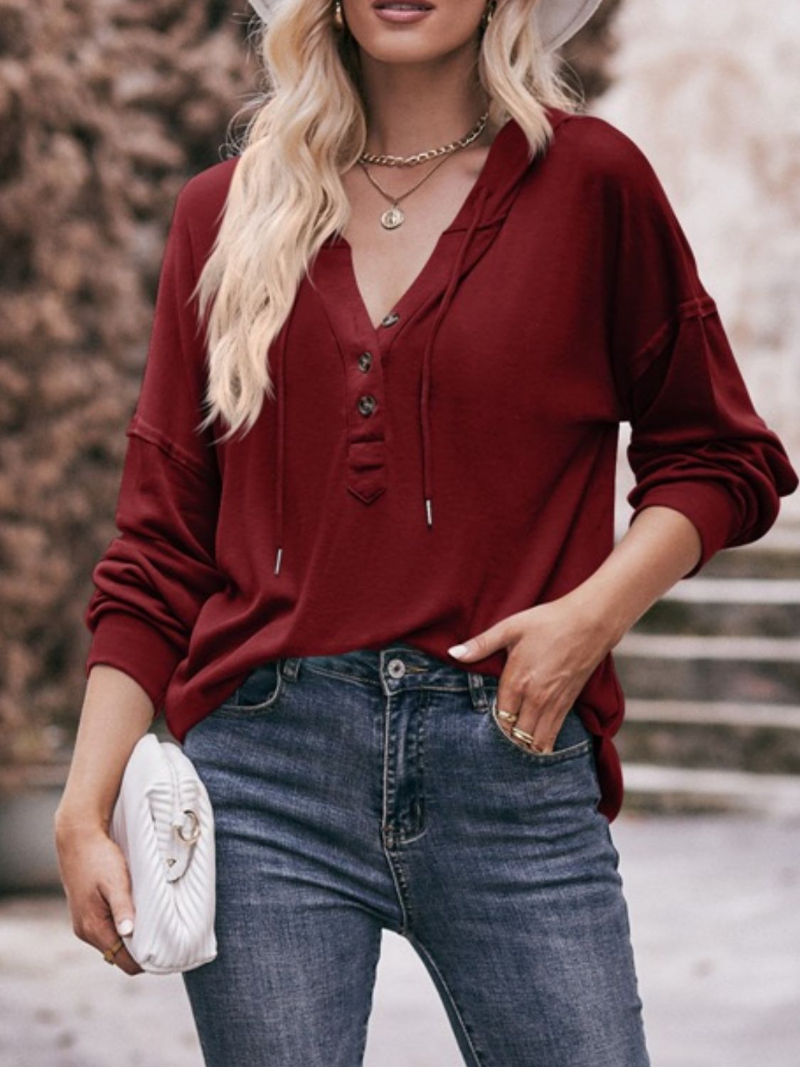 Drawstring drop shoulder long sleeve hoodie with buttons.